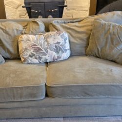 Comfy Green Couch And Pillows