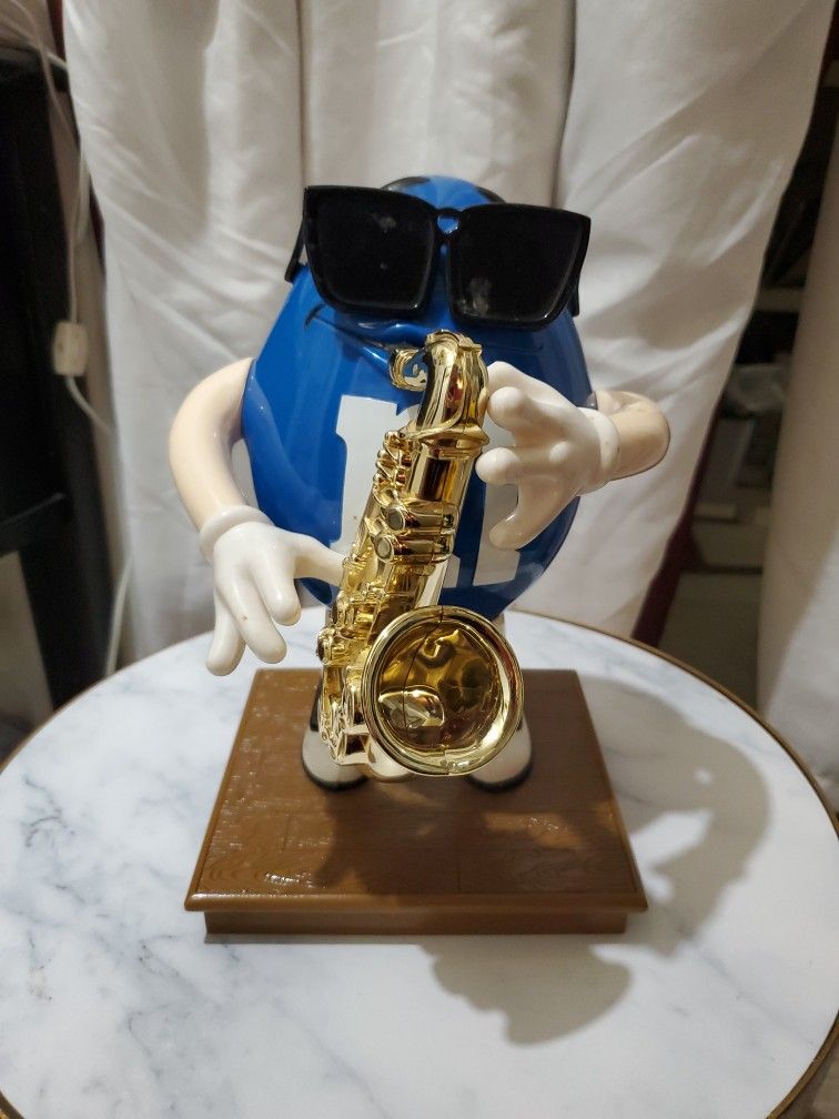 Blue Saxophone M&M Figure On Pedestal