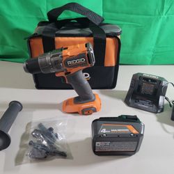 RIDGID 18V Brushless Cordless 1/2 in. Hammer Drill/Driver Kit with 4 Ah Battery, Charger and bag.

New but without a box.