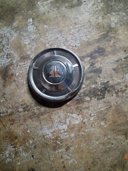 62 cutlass hubcap