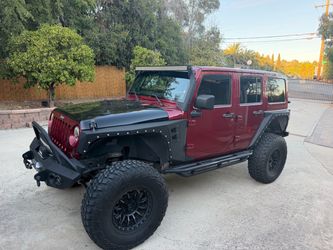 2012 Jeep Wrangler Unlimited Rubicon • 93K • Fully Caged • Long Arm • 37s