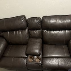 Leather sofa with recliner for 2 cup holder
