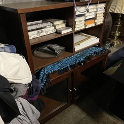 Two matching stands one has two glass doors the other has four shelves great condition we sell all the time