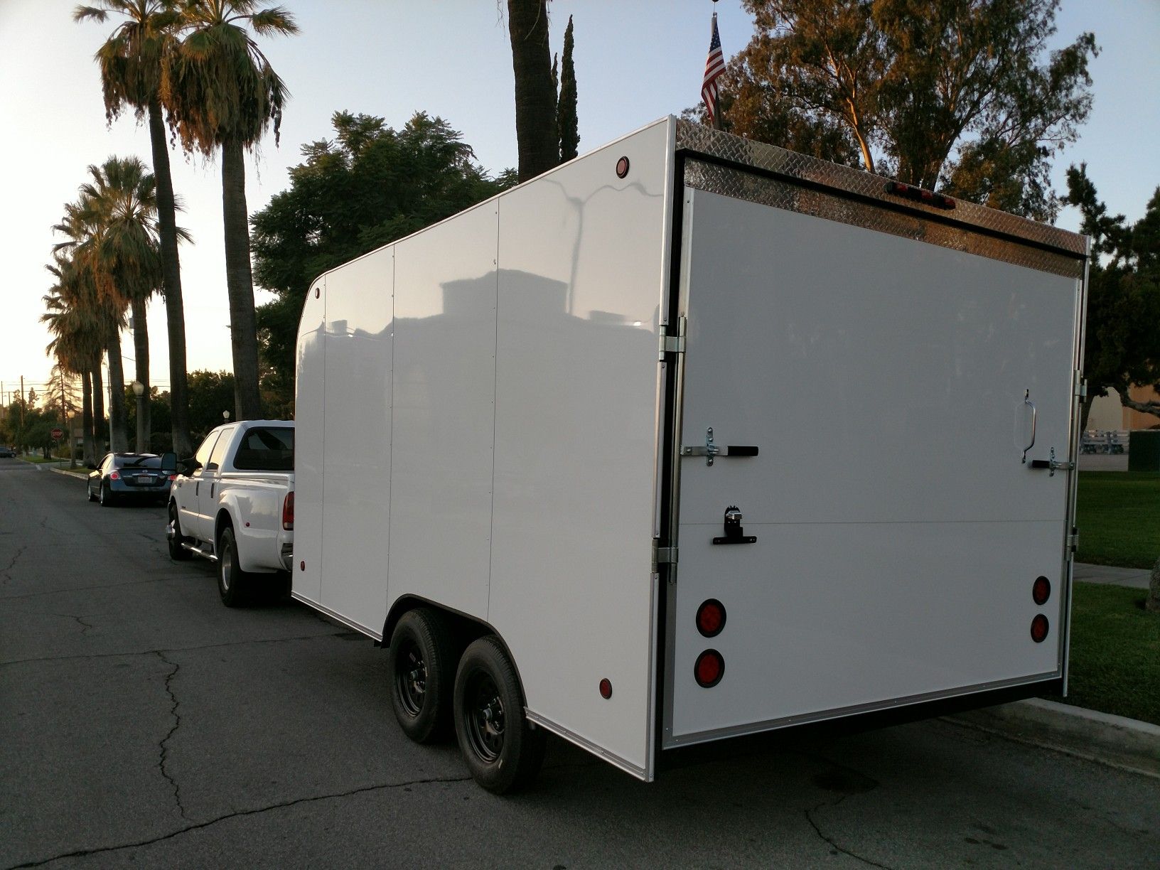 14' enclosed 8.5' wide rental trailer. 8.5' wide x 7' tall with 6'6" door. 36" RV Side door + 4 D rings in floor. Rent $140/ day.