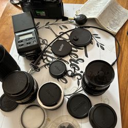 Canon camera/ Lens/ lens caps / Flash/Canon film/Camera brush/2 camera clickers