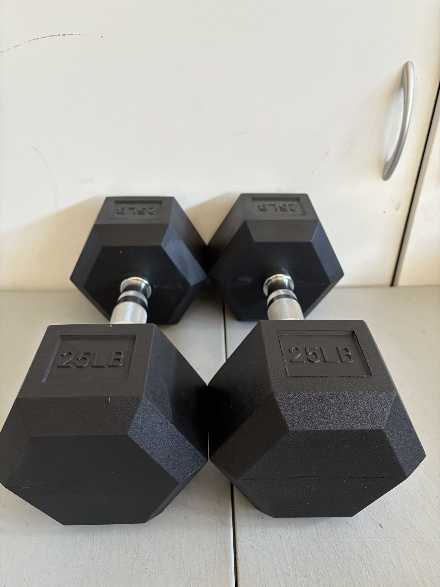 Brand New Pair Of 25 Lb Dumbbells 