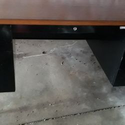 A really nice reliable desk used for tvs or work