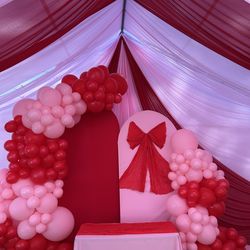 Balloon backdrops draping canopy tables chairs