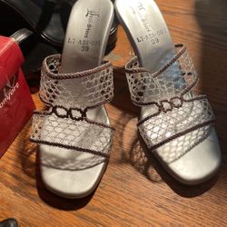 Good condition 3 1/4 inch heel silver .