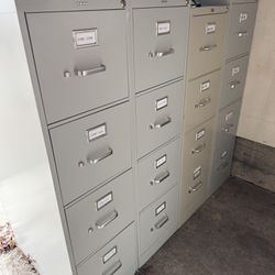 16 Four drawer Filing Cabinets 