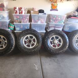 4 Americus Rugged MT 315/75-R16 Tires  Monted  On Ford 8 Lug  With Center caps 