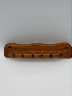 Vintage handcrafted solid wooden wall-mounted rack