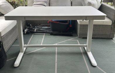Powered height adjustable computer table