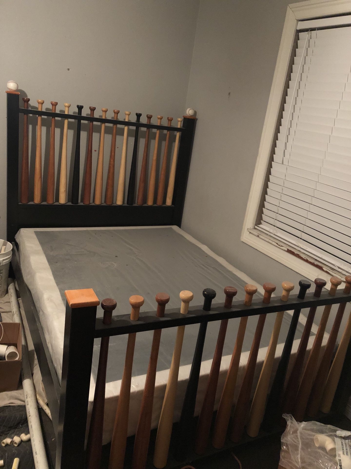 Rooms to go Baseball bat bed with two nightstands.