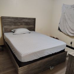 Matching Wood Bedframe And Dresser With A Mirror