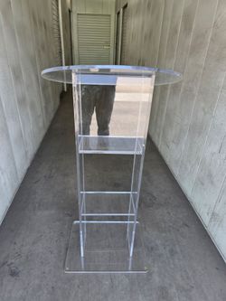 acrylic podium features a built-in storage shelf, similar to the Oklahoma Sound 401S model.