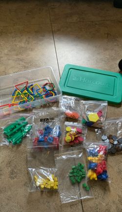 Harcourt counters, links, learning bears, fake coins, blocks, and shapes.