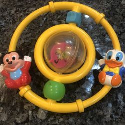 Vintage Disney Babies 1980’s Toys Rattle with Mickey Mouse, Donald Duck And Pluto.  Size 6 1/2 inches wide.  Preowned good condition.  Has been on dis