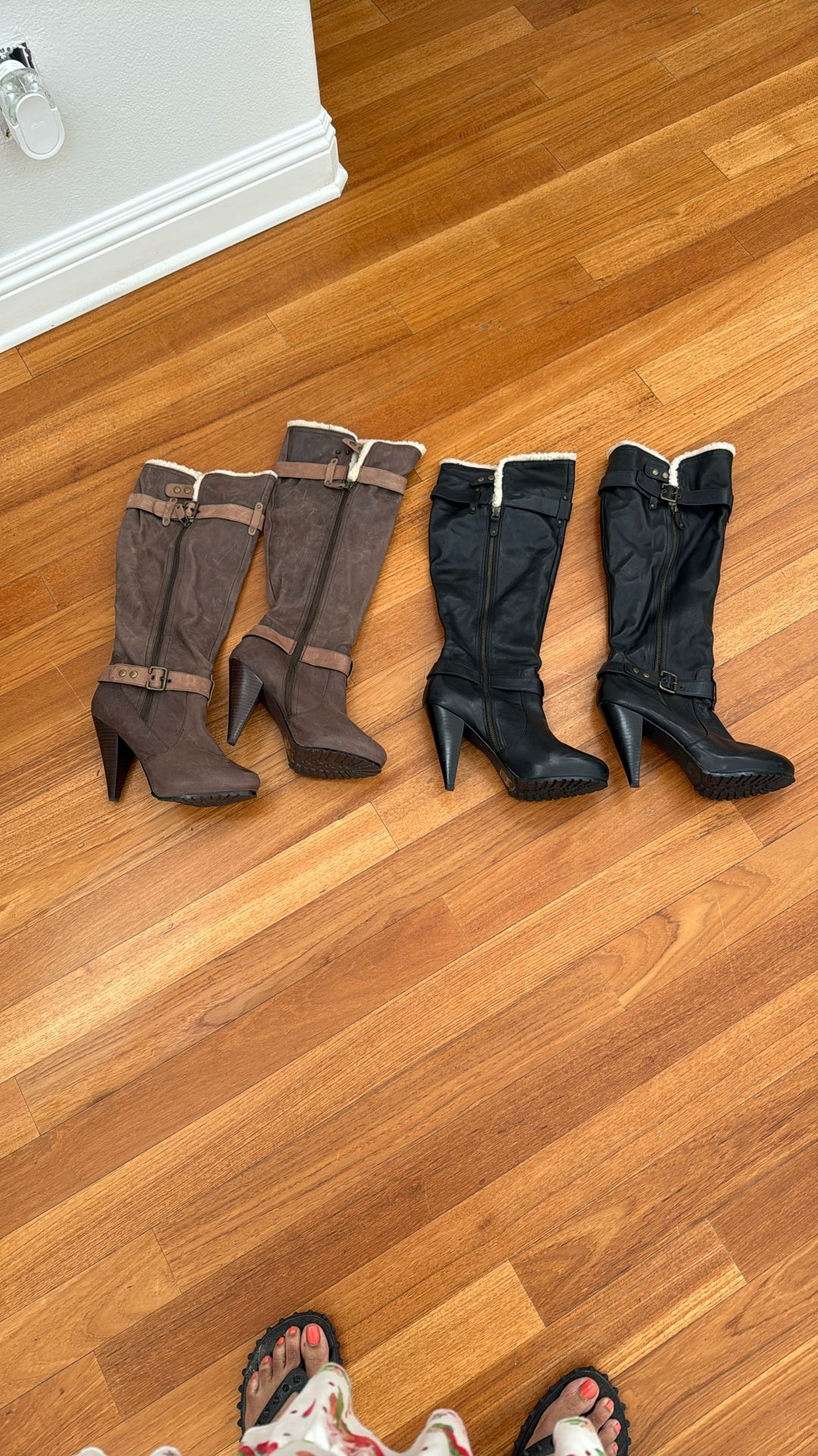 One black pair of leather boots, size 10, and one pair of brown chestnut boot size 10