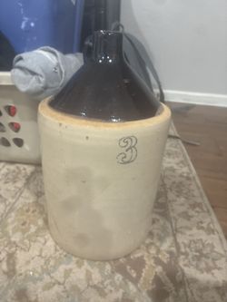 Moonshine Jug Used As Yard Art
