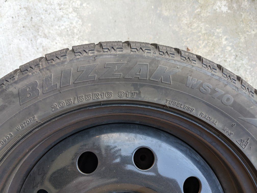 Bridgestone Blizzak WS70 Snow Tires 205/55R16 On Black Steel Rims