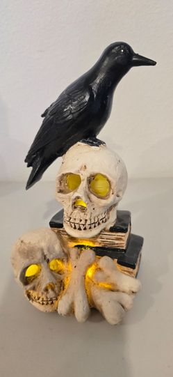 Light-Up Halloween Crow on Skull, Books, and Bones Figurine