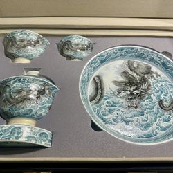 “Ink Dragon Roaming the Sea” ceramic tea set. 