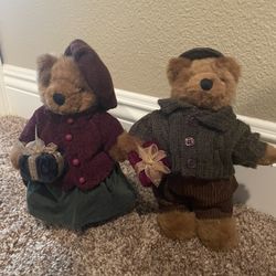 Bears Dressed In Christmas Outfits On A Stand 