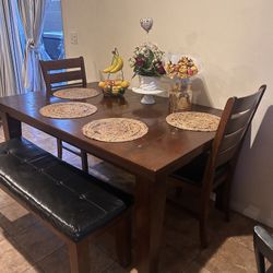 Table (4) Chairs (1) Bench