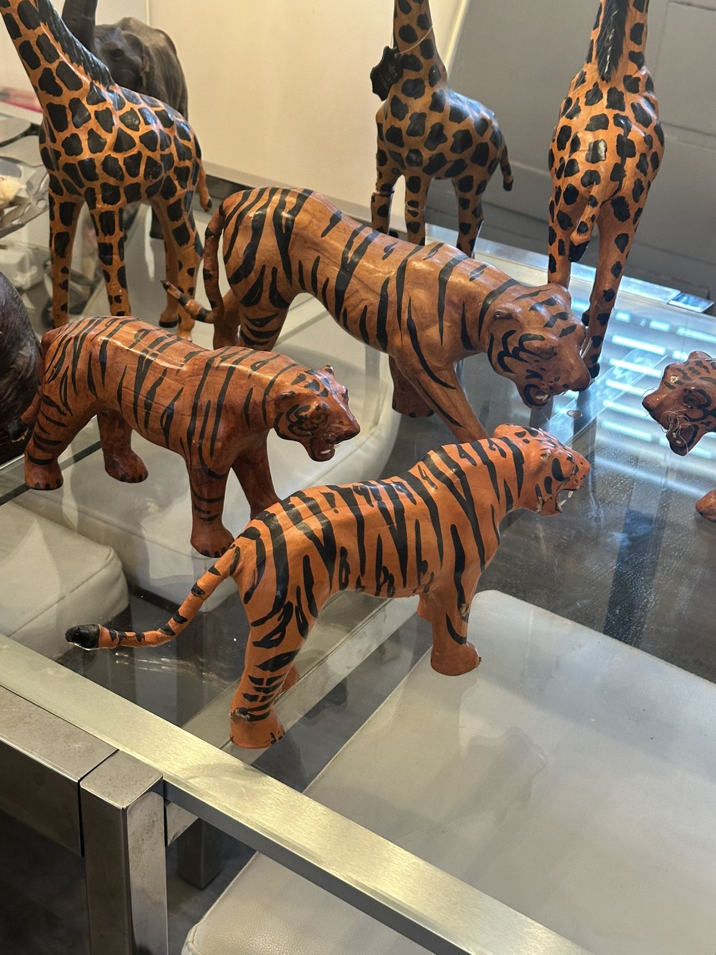 Four vintage leather tigers