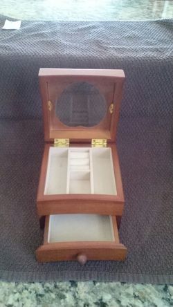 Small jewelry box with heart shaped window.