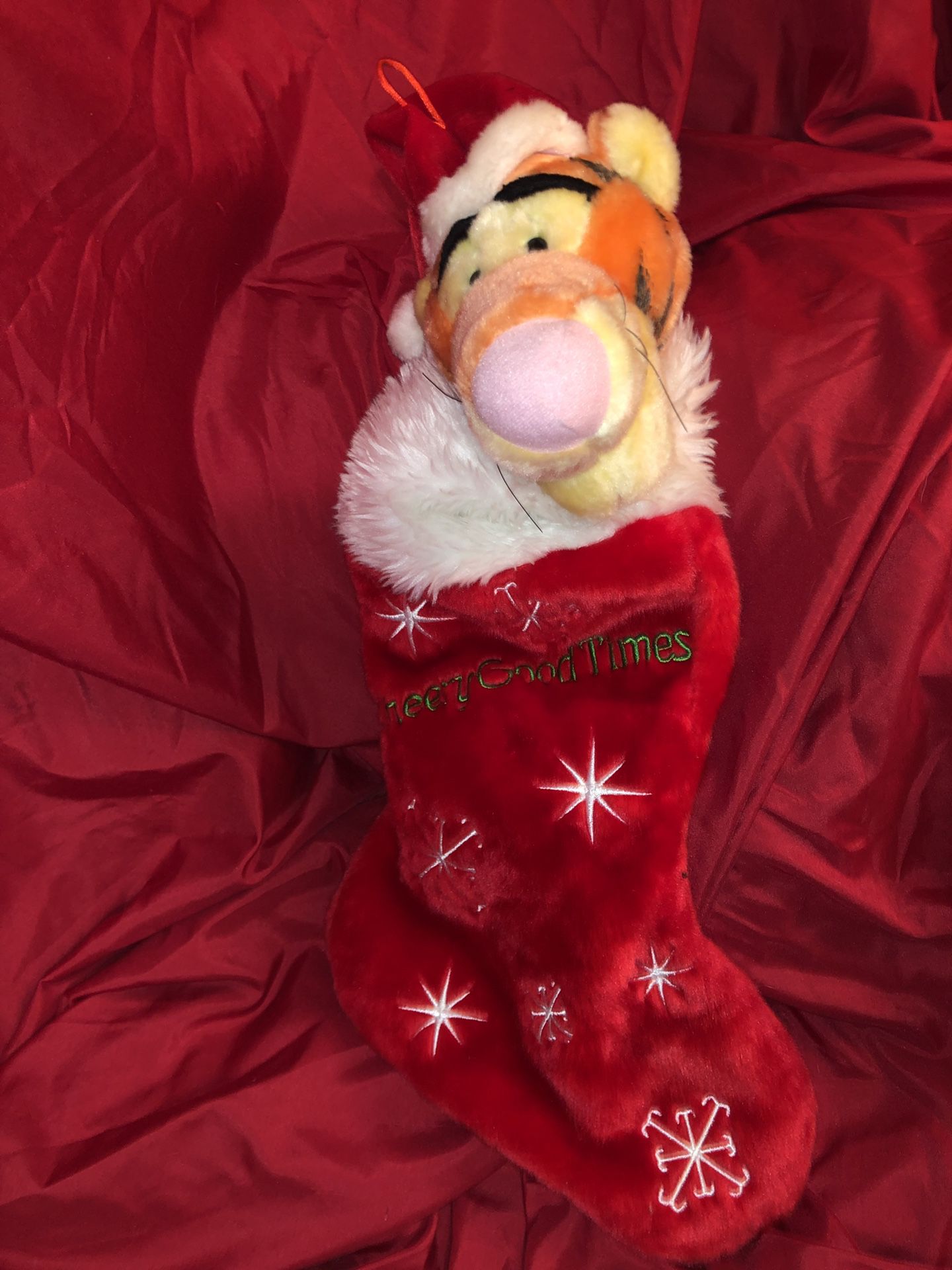 Disney Winnie the Pooh (Tigger) plush Christmas stocking ! Santa is wearing a red Santa Claus hat! This is battery operated plush Christmas stocking