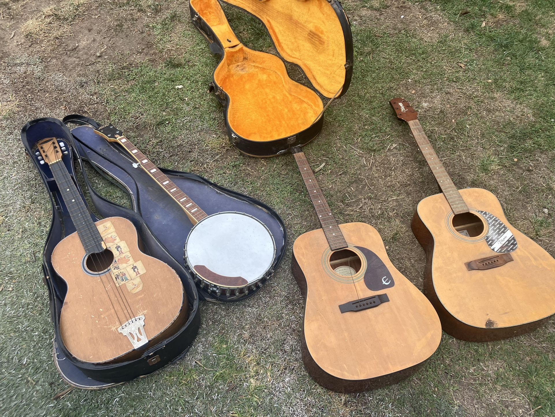 Broken Guitars and Banjo for parts.