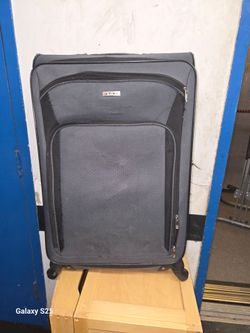 grey soft-side Tag Coronado III suitcase 26 inch