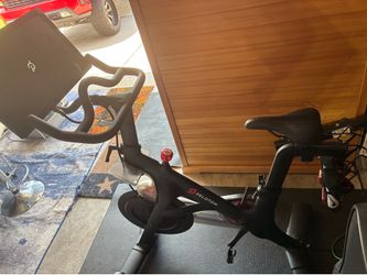 Peloton Bike with mat and shoes
