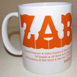 The Zabar's Ceramic Coffee Mug is a vintage piece perfect for all occasions, with a round shape and orange color. This original 8 oz coffee cup featur