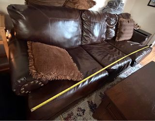 Leather couch  38 inches depth and 99 length