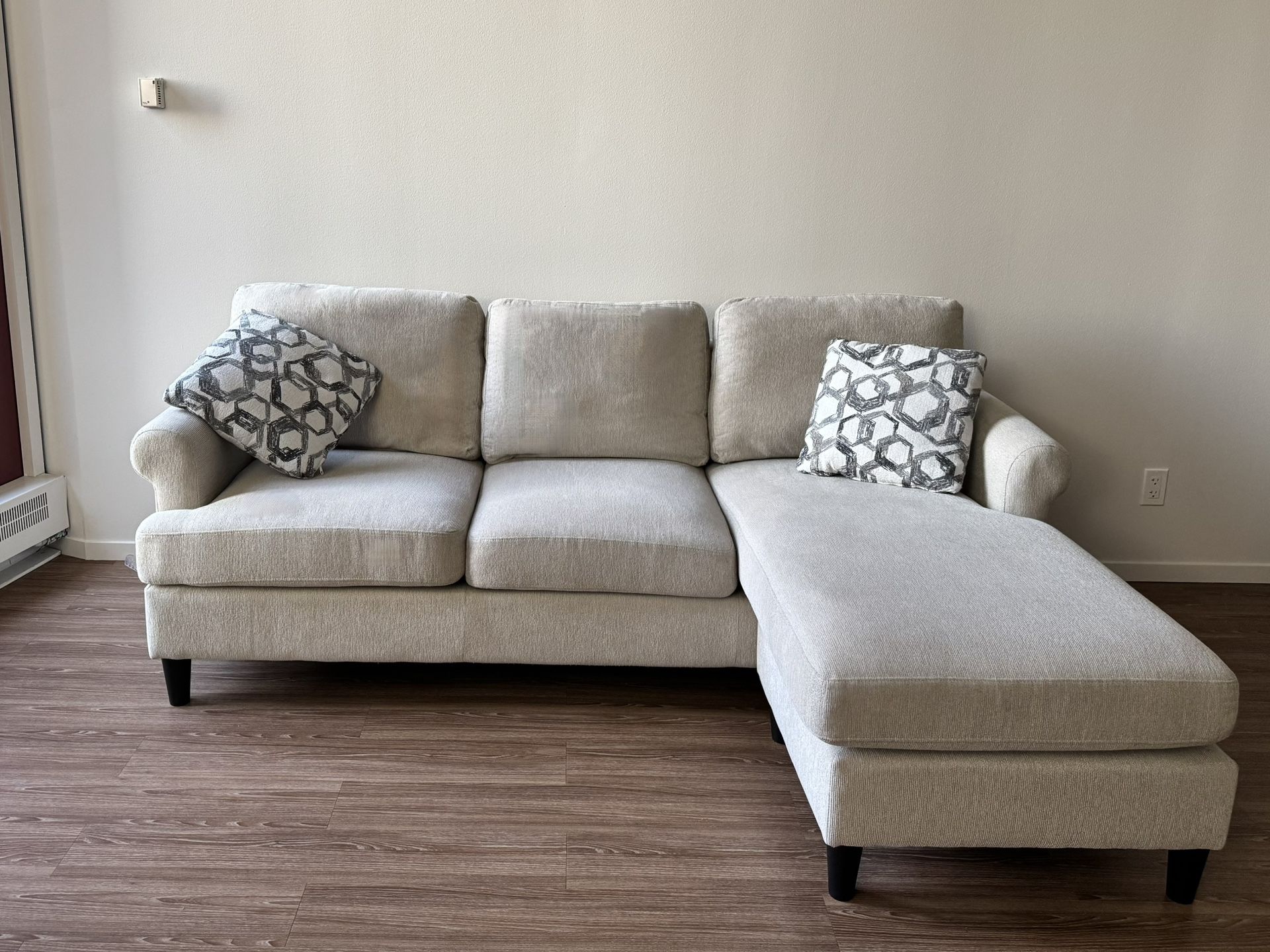 Living Spaces Emery Chiffon Beige Fabric 84” Sectional Sofa With Reversible Chaise