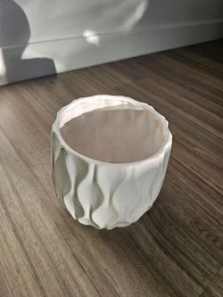 Intricate white ceramic vase