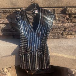 Black and silver sequence dress by Parker women’s size small. 100% silk/lining rayon . Has back sipper. measures30 inches in length and 16 inches acro