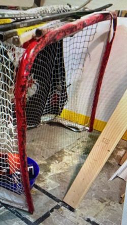 Hockey Net And Hockey Sticks