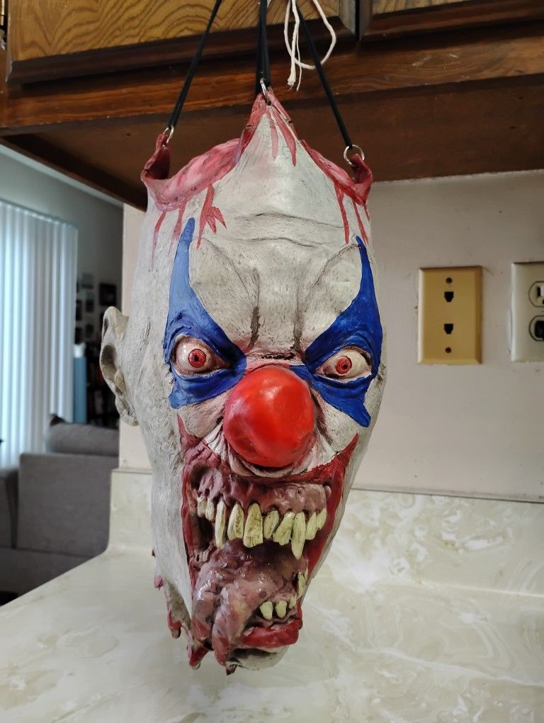 Chopped off clown head mask Halloween creepy