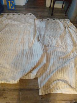 Two thick curtains great for blocking out the sun