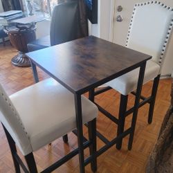 Two Bar Stools With Table