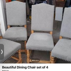 Beautiful dining chairs, elegant gray in color, with real wood legs. There are 6 chairs, they need a new home.