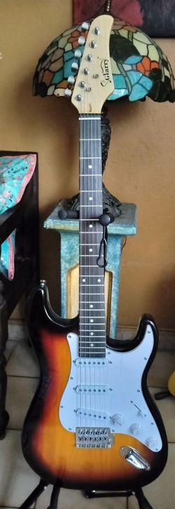 New electric guitar with new gig bag cable and shoulder strap