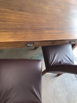 Purchased From Ashley’s Furniture Home Store Wooden and Leather Dining Room Set
