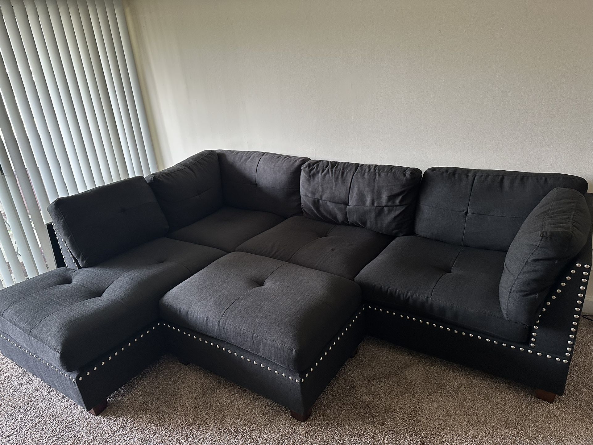 black fabric sectional couch