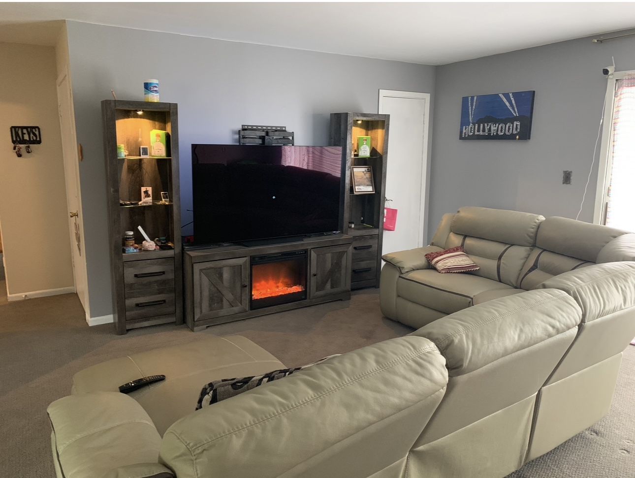 For Sale: Ashley Furniture Electric Fireplace TV Stand with Side Cabinets – $300 (Delivery Available)