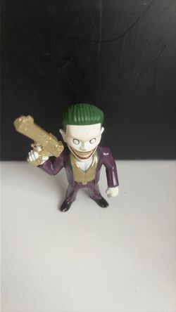 DC Joker Mini Action Figure The item appears to be The Joker "Boss" Die-Cast Figure from the Jada Toys Metals Die-Cast Suicide Squad collection.
